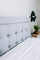 Light gray upholstered headboard paired with a neatly made Zinus mattress, highlighting tufted fabric details, clean stitching, and a modern, minimalist bedroom style that emphasizes comfort, support, and soft, neutral design.