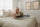 Happy woman hugging Zinus Ultra Cooling Green Tea Hybrid Mattress on Linda Platform Bed Frame, highlighting contouring comfort and cool sleep support