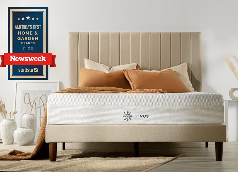 Zinus mattress on a beige upholstered bed with warm neutral pillows, shown beside a Newsweek award badge reading “America’s Best Home & Garden Brands 2023” to highlight comfort, quality, and recognized brand performance in a calm modern bedroom