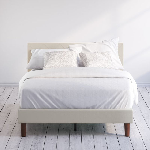 Zinus Shalini Upholstered Platform Bed Frame styled with white bedding in a minimal bedroom. The diamond-stitched headboard in dark gray fabric adds sophistication, while durable slats provide strong mattress support without the need for a box spring