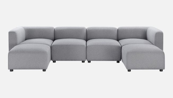 Gray modular sectional sofa with low-profile design and armless pieces arranged in an open U-shape, upholstered in smooth fabric for a modern living room look.