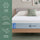 Zinus Cooling Green Tea Memory Foam Mattress, Queen, on wood platform bed frame with white pillows and sage cushion, side icons reading cooling comfort, targeted pressure relief, and all-night freshness.