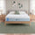 Zinus Cooling Green Tea Memory Foam Mattress, Queen, staged on wood platform bed frame in bedroom with white pillows, sage cushion, and label text reading cooling green tea memory foam.