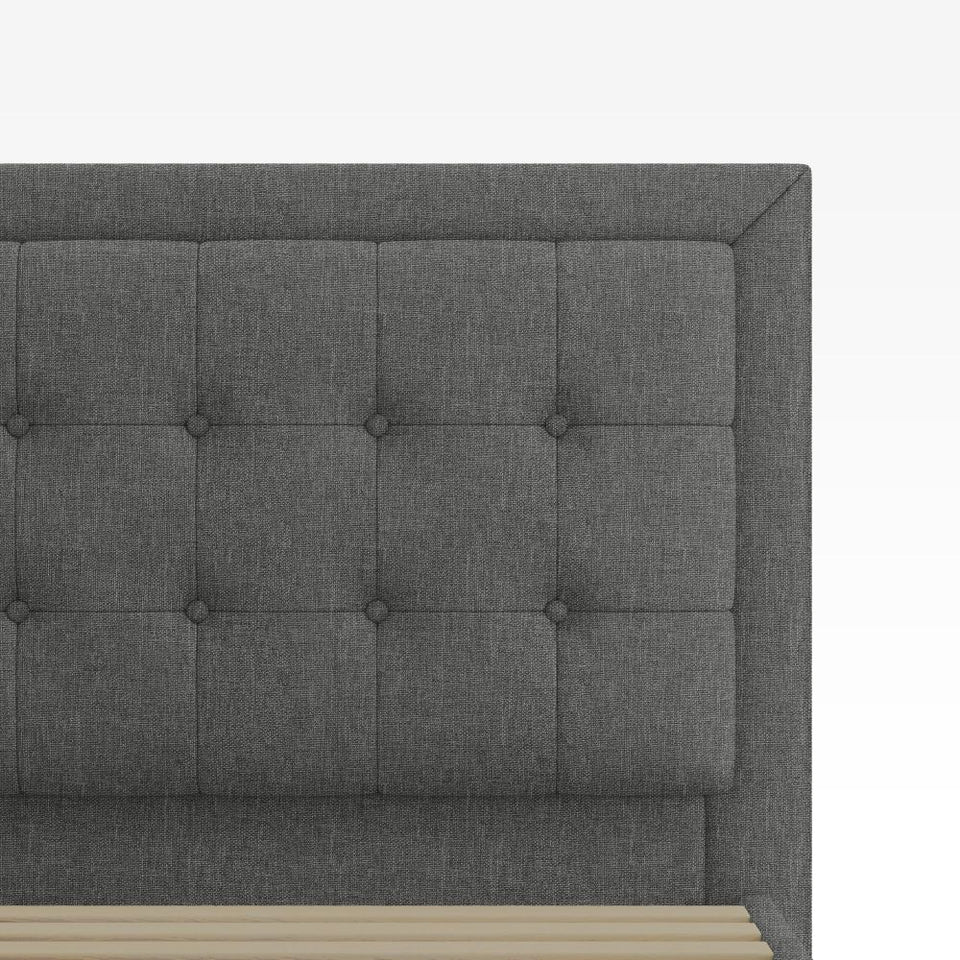 Close-up of Zinus Dachelle Upholstered Platform Bed Frame headboard in dark gray. Features modern square tufted design with soft padded upholstery for comfort and style, showcasing craftsmanship and elegant detailing.
