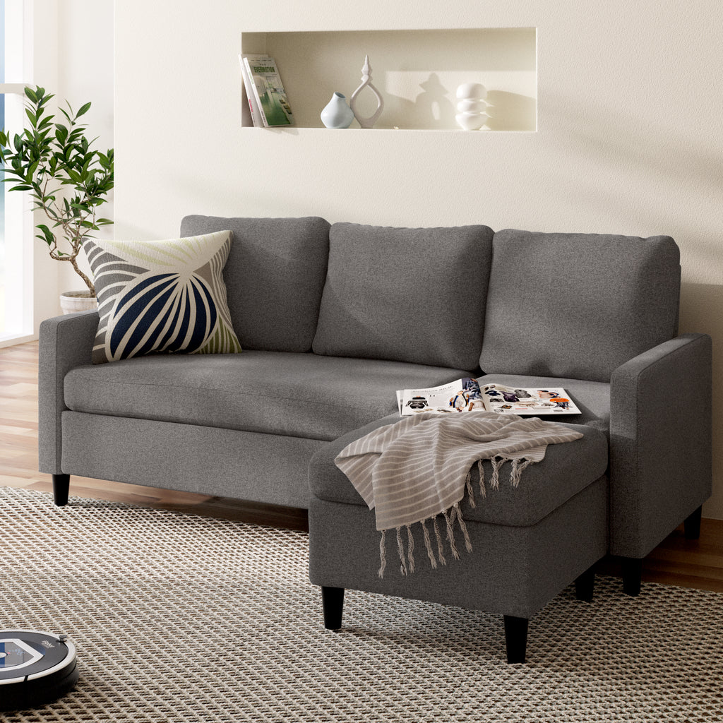 Zinus Hudson Convertible Sectional Sofa in gray with versatile ottoman placed separately in front. Upholstered cushions and slim arms offer comfort and support, while the ottoman can be positioned as a chaise or standalone seat, adapting easily to different living room layouts. 