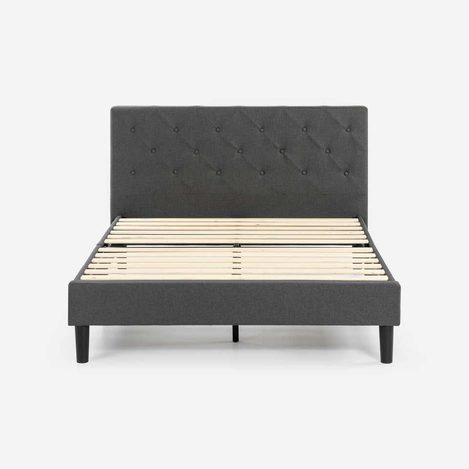 Front view of Zinus Upholstered Platform Bed Frame in gray fabric with tufted headboard. Sturdy wood slats provide mattress support without box spring, while minimalist legs and padded frame combine comfort and style. A durable, modern solution for a cozy bedroom setup